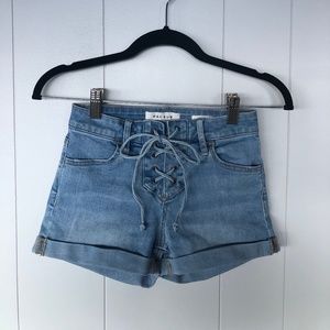 lace up high-waisted light wash denim shorts